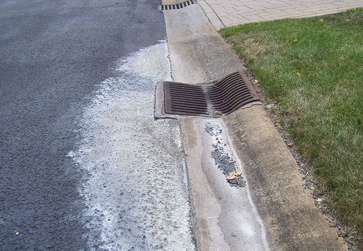 photo about paint discarded into storm drain